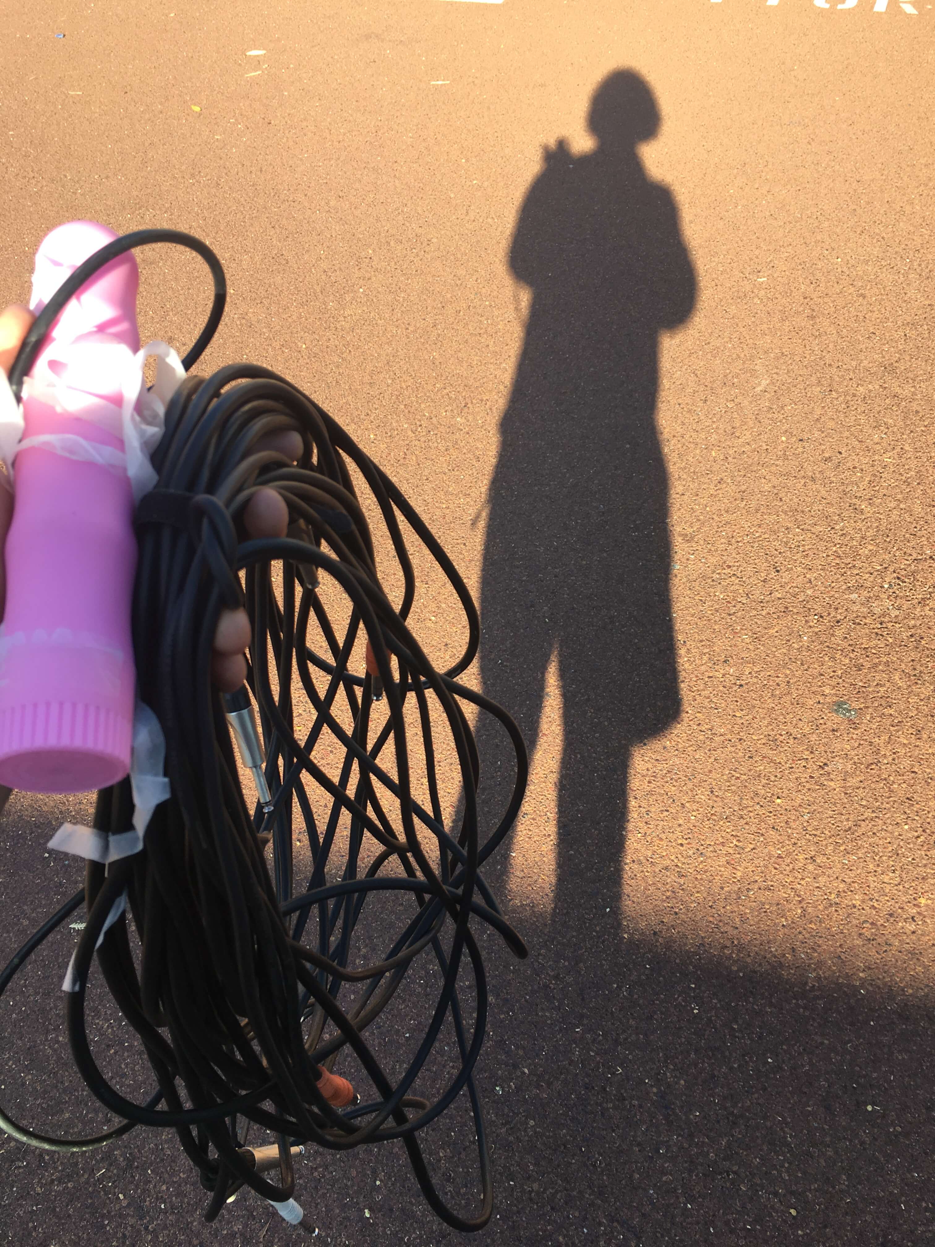 standing in the church car park holding TRS cables and a pink plastic vibrator